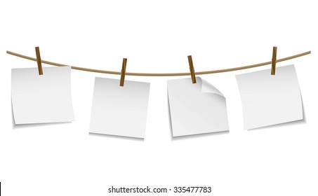 Blank white notes hanging on clothesline with clothespin