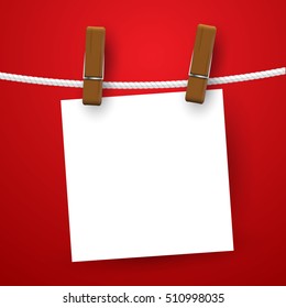 Blank white notes hanging on clothesline