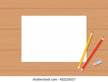 Blank white paper with pencil on wood table. Album pages with pencils for drawing on a wooden table