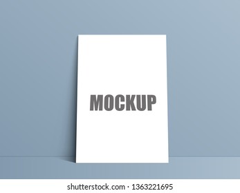 Blank white paper poster standing on floor. Poster mock-up template