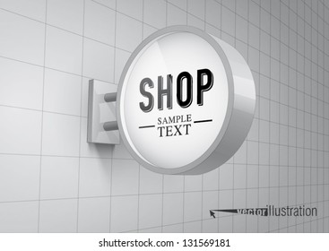 Blank, white round shop sign hanging on a wall