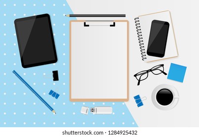 Blank white sheet on clipboard with tablet, coffee cup, notebook, donut, USB Flash Drive, eyeglasses and smartphone on blue and gray background