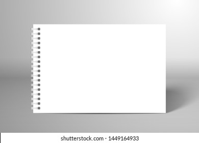 Blank white spiral notebook or album. Mockup for design with shadow