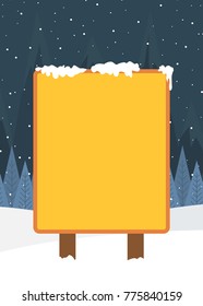 Blank yellow billboard in winter landscape