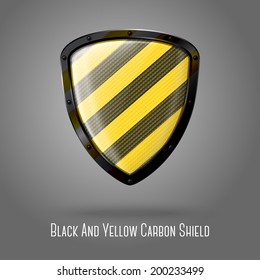 Blank yellow and black caution realistic glossy shield with glossy carbon texture and black border isolated on grey background with place for your design and branding. Vector