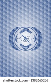 blind icon inside blue emblem with geometric background.