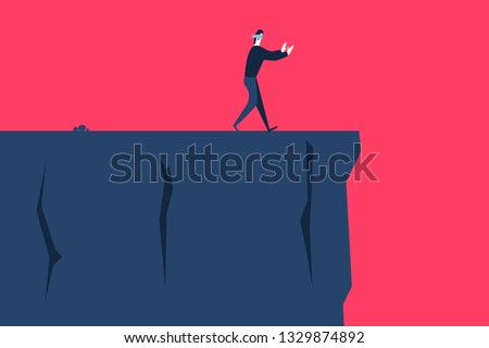 A blindfolded man goes to the cliff
