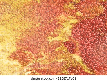 Blistering paint abstract in hot red, fiery orange and yellow flames