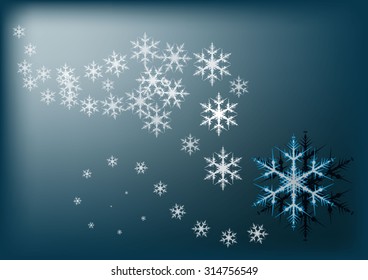 Blizzard on a blue background large and small snowflakes