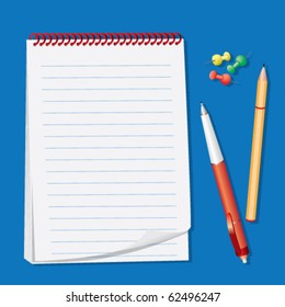 Blocknote and pens isolated on a blue background