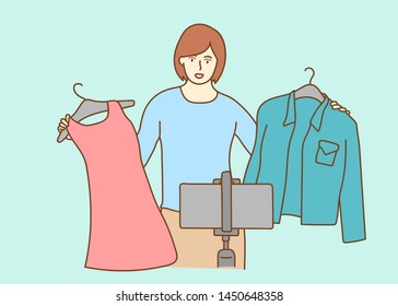 blogger live broadcasting sell clothes viral video clip by smartphone sharing on social media