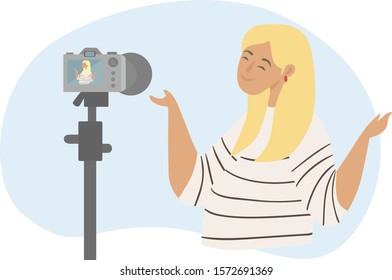 Blogger records video on the camera. Concept of live streaming, broadcast, social media networking, personal blog, making money on the Internet on creativity. Girl takes video of herself on camera