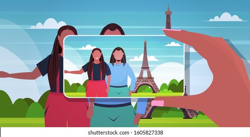 blogger using smartphone camera photographing african american travelers couple on mobile phone blogging shooting vlog concept paris abstract city silhouette background portrait horizontal vector