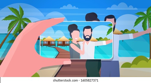 blogger using smartphone camera photographing happy man woman travelers couple on mobile phone blogging shooting vlog concept summer vacation seascape background portrait horizontal vector