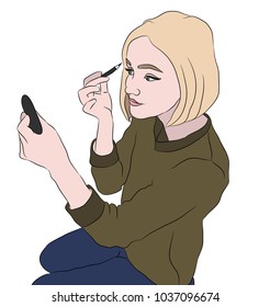 Blond girl doing a make up