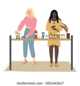 Blonde and black girls choosing bodycare and home products in cosmetics store