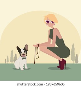 Blonde girl with her french bulldog in the park
