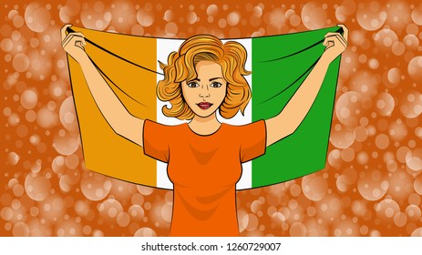 Blonde girl holding a national flag of Ivory Coast
