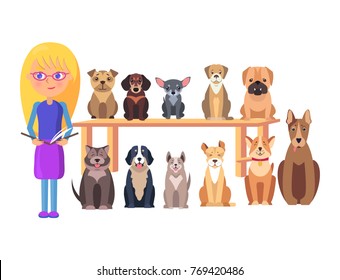 Blonde schoolgirl with open book and dog group of different breeds sits on table and floor in row vector illustration on white