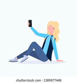blonde woman taking selfie photo on smartphone camera female cartoon character sitting girl posing on white background flat full length