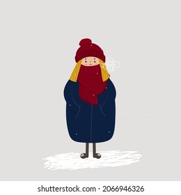 A blond-haired girl standing outside in winter. She is wearing a knitted hat and scarf, and a down jacket