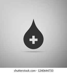 Blood drop icon isolated on grey background. Donate drop blood with cross sign. Donor concept. Flat design. Vector Illustration