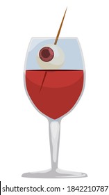 Bloody drink served in glass for Halloween, decorated with eye shape in a pick, isolated over white background.