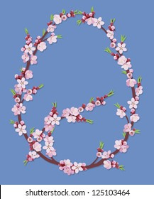 Blooming branches of apricot in a egg shape on a blue background