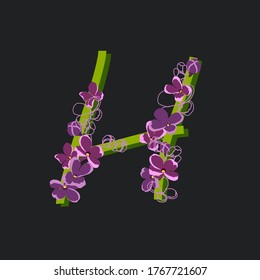 Una letra inicial en flor H. Fuente floral decorativa sobre un fondo oscuro. Tipografía de plantas de huerto vintage. Alfabeto de flores de lila.