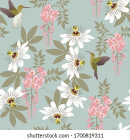 Blooming wisteria,passionflowers and hummingbirds on a gray background. Seamless vector illustration. For decorating textiles, packaging, wallpaper.