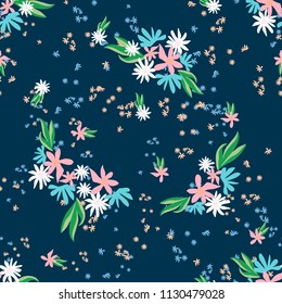 Blossom floral seamless pattern. Blooming botanical motifs scattered random. Trendy color vector texture. Good for fashion. Ditsy print. Hand drawn small flowers on blue background with polka dots
