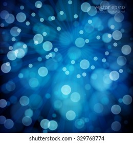 Fondo azul abstracto con luces de bokeh desenfocadas.