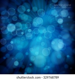 Blue abstract background with bokeh defocused lights.
