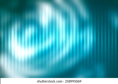 Blue abstract blur colored background with defocused vertical rays of light.