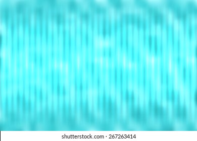 Blue abstract blur colored background with defocused vertical rays of light.