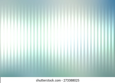 Blue abstract blur colored background with defocused vertical rays of light.