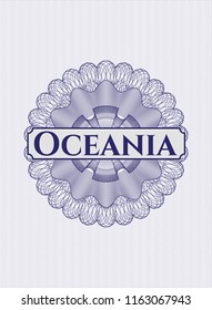 Blue abstract rosette with text Oceania inside