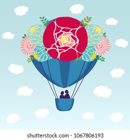 A blue aerostat balloon in the sky among the clouds and birds. The ball is decorated with flowers, leaves and berries. In the basket there are 2 people, a couple in love. Vector color illustration.