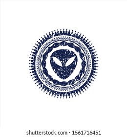 Blue alien icon inside distress rubber stamp