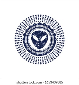 Blue alien icon inside distressed grunge style stamp