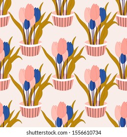 Blue and. pink tulips in a seamless pattern design, perfect to use on the web or in print