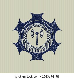 Blue antenna signal icon inside distress rubber seal with grunge texture