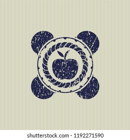 Blue apple icon inside distressed rubber texture