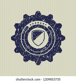 Blue armor icon inside distress rubber grunge stamp