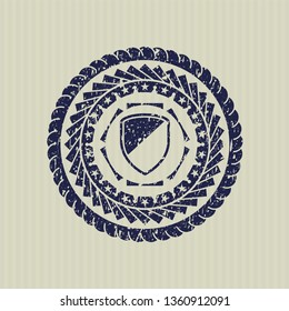 Blue armor icon inside rubber grunge texture stamp