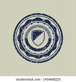 Blue armor icon inside rubber stamp