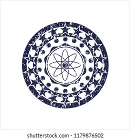Blue atom icon inside distress rubber stamp with grunge texture