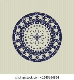 Blue atom icon inside distressed rubber texture