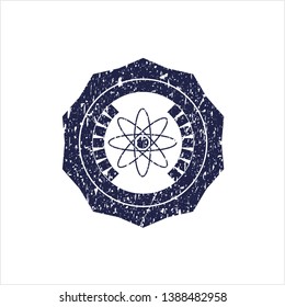 Blue atom icon inside distressed grunge seal