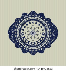 Blue atom icon inside grunge seal